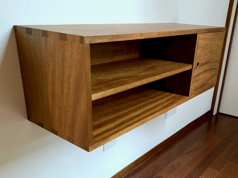 Sustainable floating hallway storage cupboard crafted from reclaimed iroko wood timber