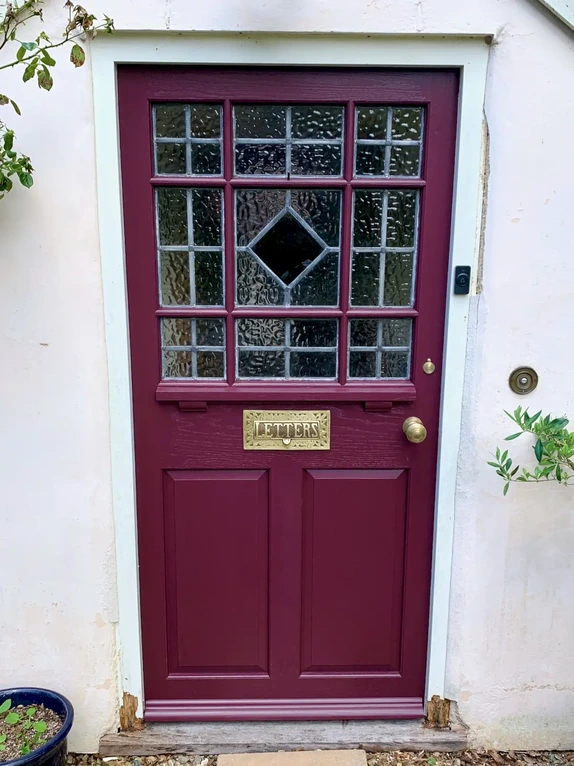 Bespoke timber front entryway door and matching sidelight framing restored antique reclaimed stained glass