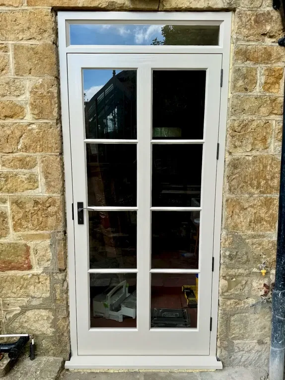 Bespoke glazed timber back doorset custom built for a secure residential exterior entryway