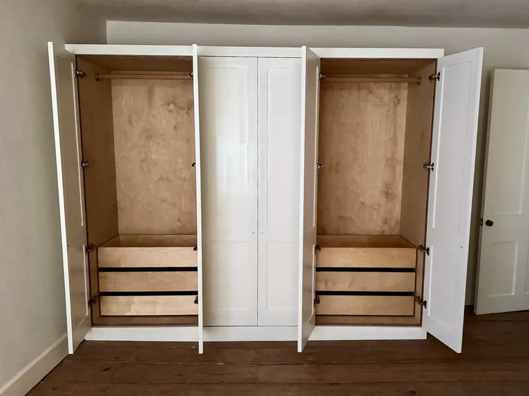 Modern clean-line bedroom run of three built-in wardrobes custom made from Baltic birch plywood