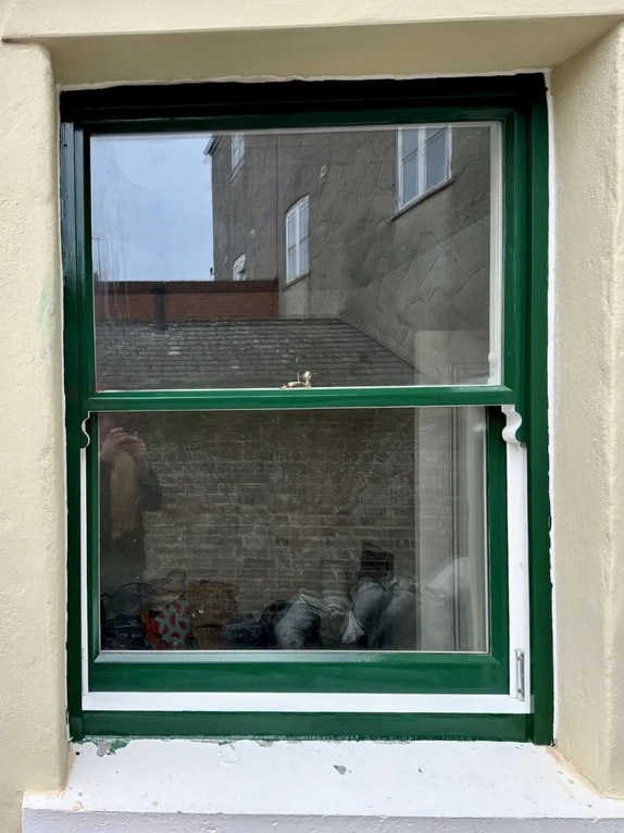 Traditional bespoke timber sprung sliding sash window installed frame assembly