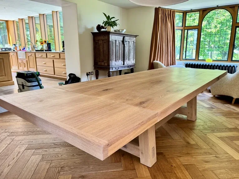 Custom large solid oak dining table with handmade extension wings